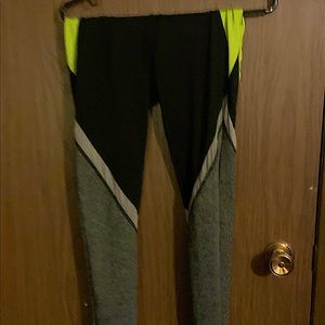 Sports leggings with white strip that see through to allow air flow. Has pocket.
